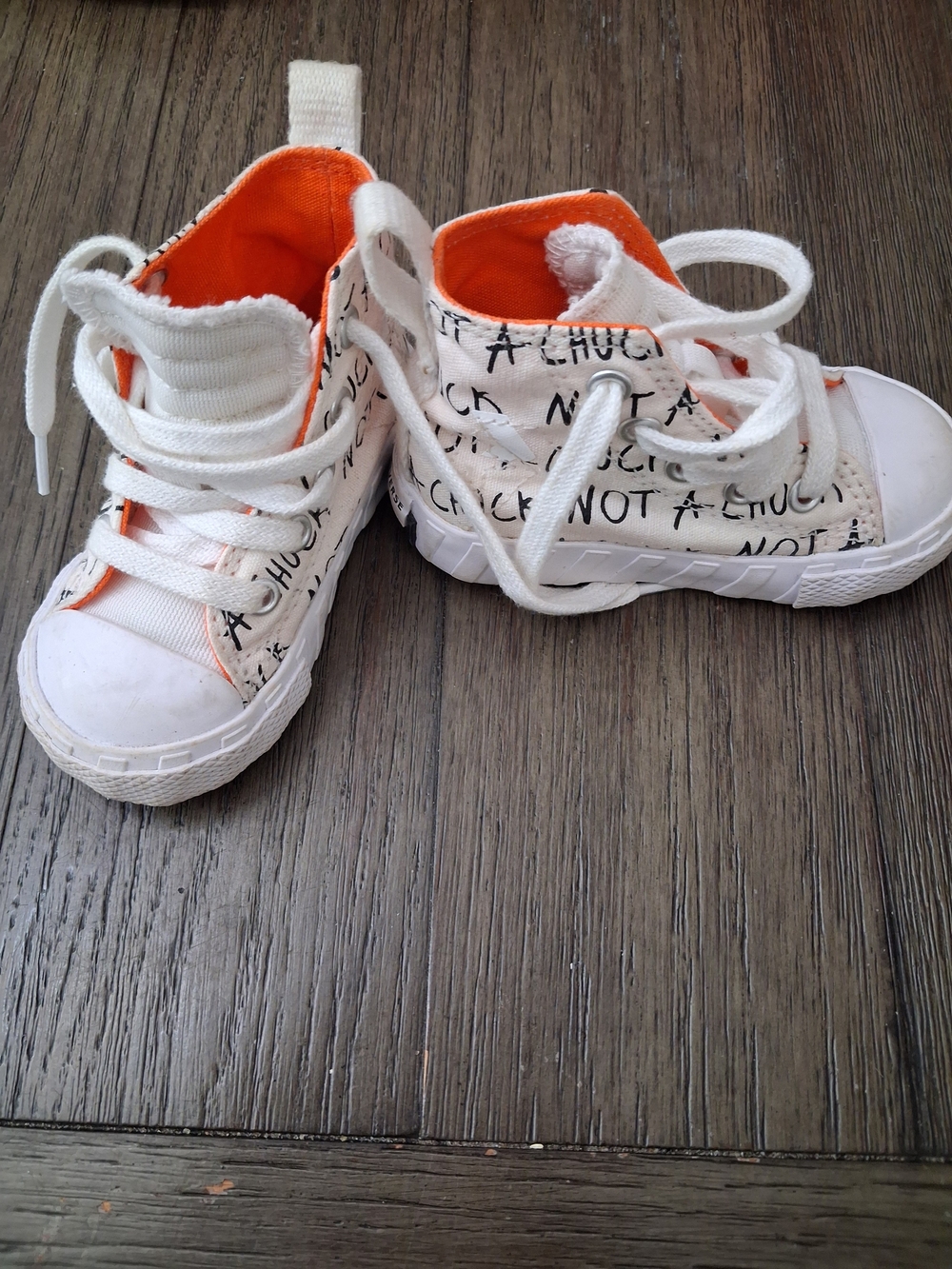 Converse Kids White Canvas High-Tops with Orange Interior and Black Script